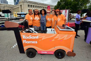 Radiant Flames members Taylor and Tawashae pose with Yara Shahidi (center) and fellow team members Therese, Athena, and Morgan in front of their winning Icebox Derby car. Yara, a star of the sitcom Black-ish on ABC®, served as the emcee of the 2016 Icebox Derby race.
